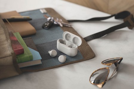 The glacier white version of the Amazon Echo Buds (2nd gen) on a desk; the earbuds just went up for pre-order.