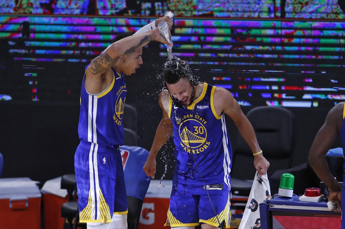Steph Curry being doused with water