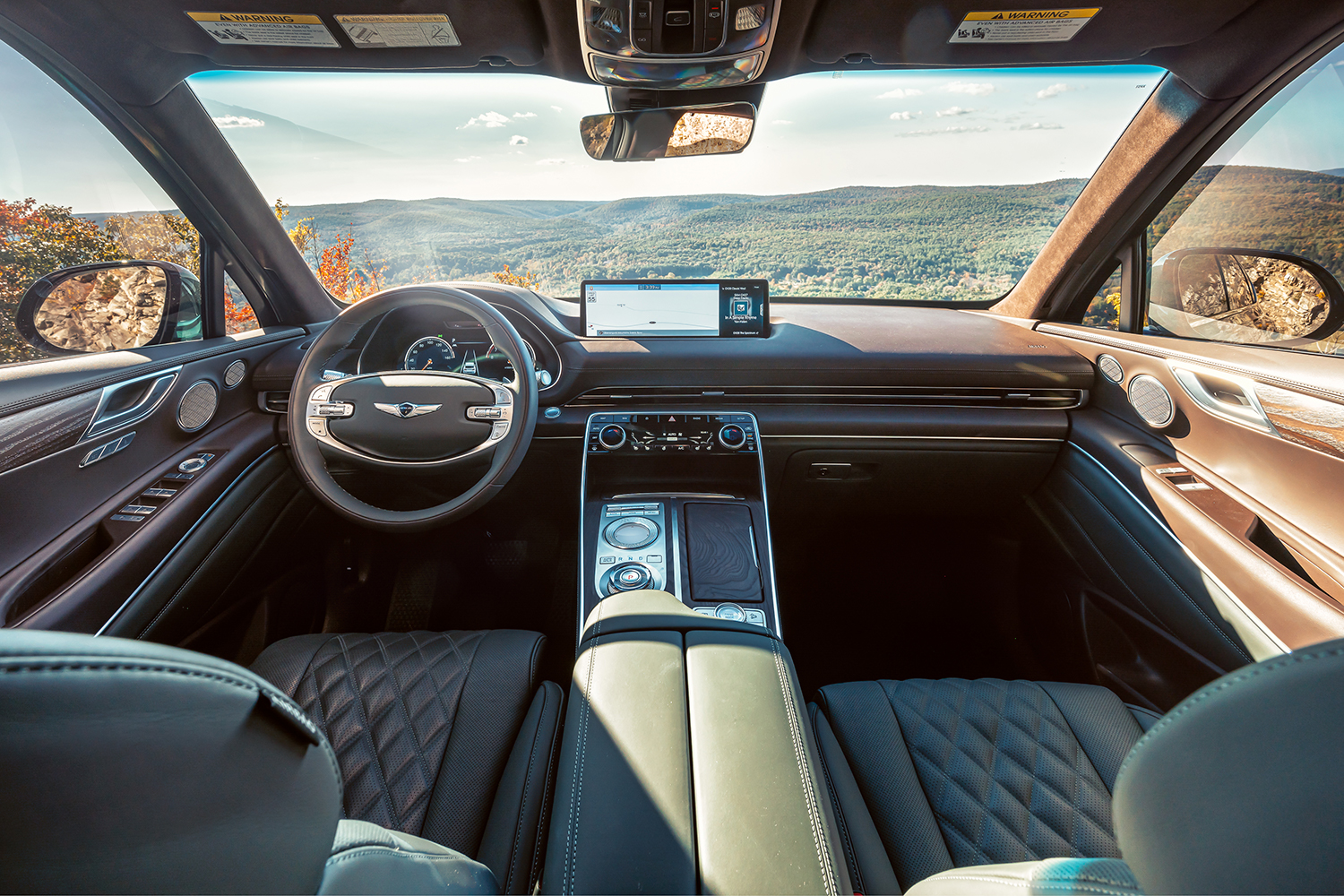 The front two seats and the dashboard on the 2021 Genesis GV80 SUV