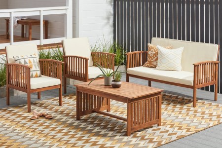 A four-piece set of Christopher Knight Home Carolina Acacia patio furniture