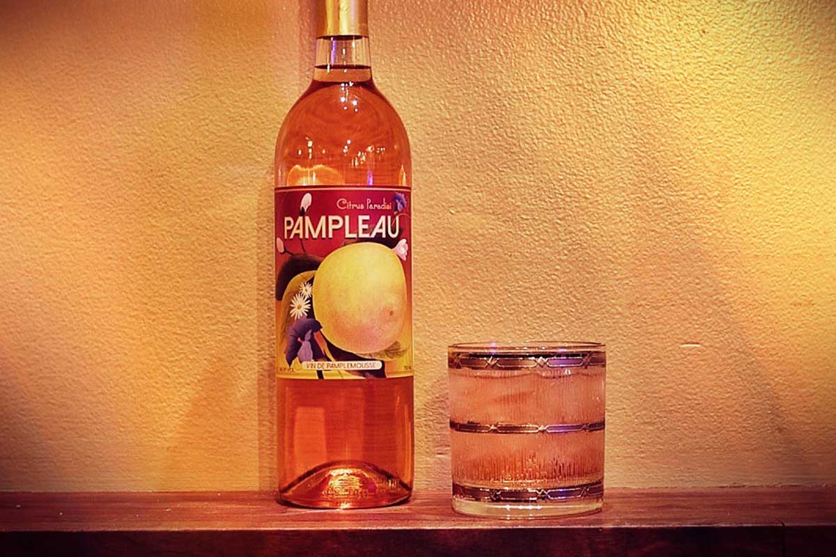 a bottle of Pampleau and it served in a glass