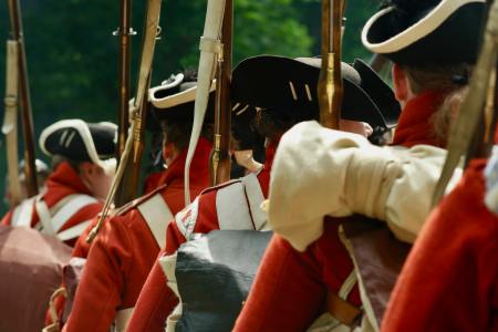 Revolutionary War reenactors standing in a line