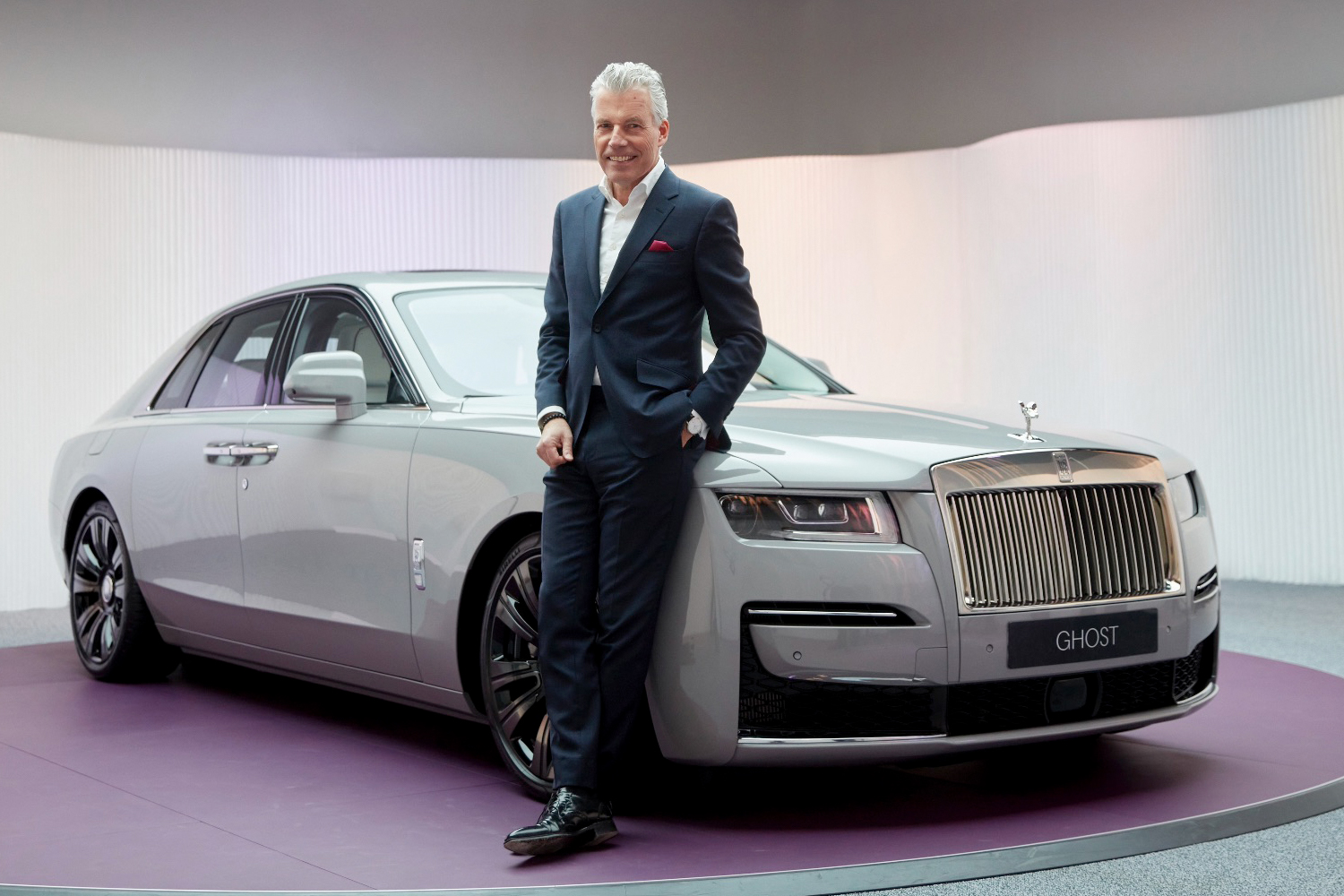 Rolls-Royce Motor Cars CEO Torsten Müller-Ötvös next to the Ghost car
