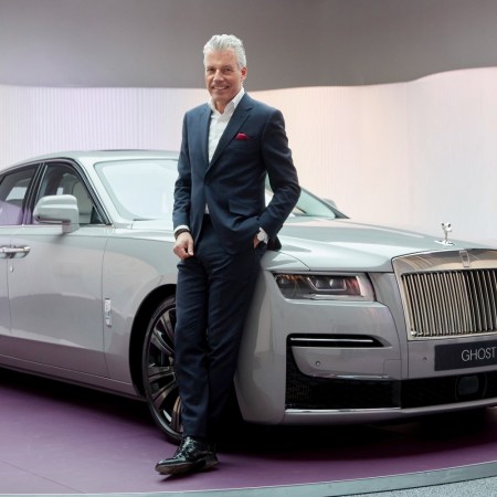 Rolls-Royce Motor Cars CEO Torsten Müller-Ötvös next to the Ghost car
