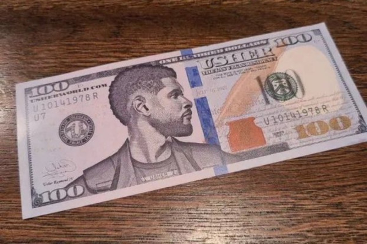 A $100 bill with Usher's face on it