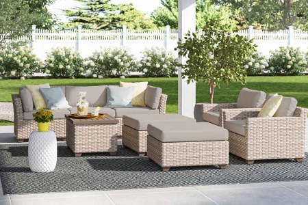 The Rochford 8 Piece Rattan Sectional Seating Group with Cushions, now $925 off at Wayfair