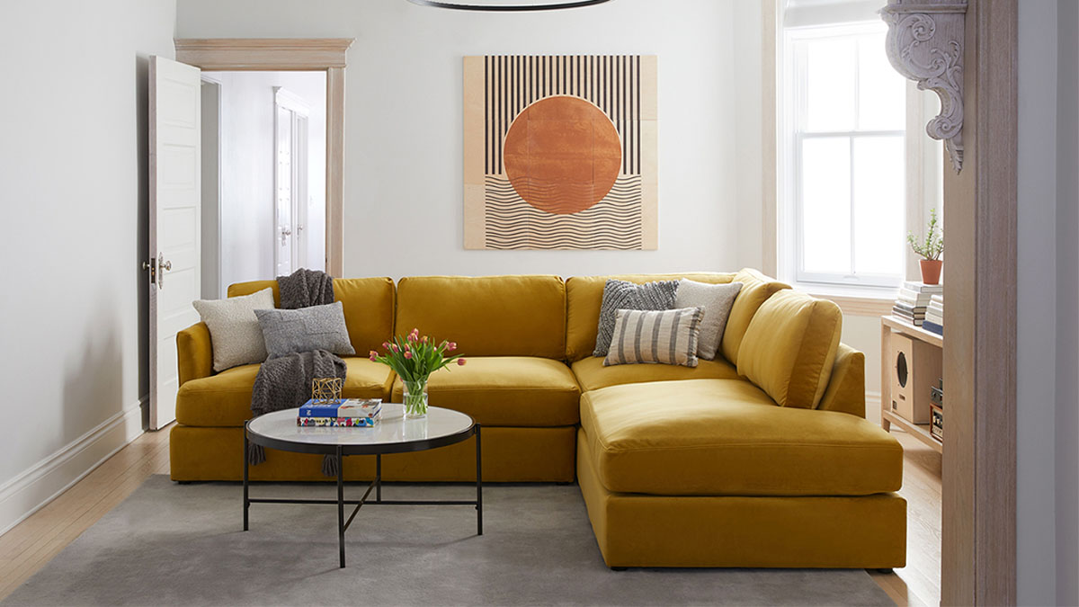 a yellow couch in a staged area