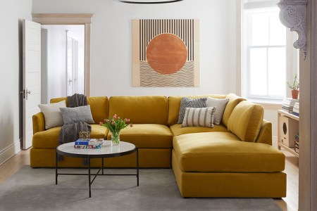 a yellow couch in a staged area