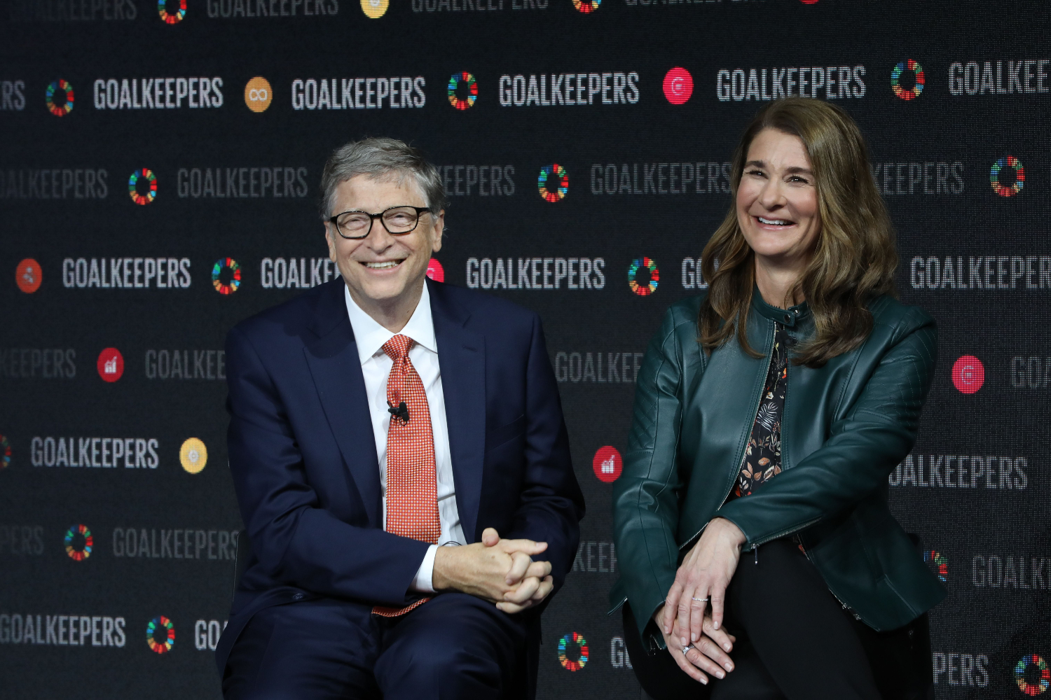 Bill and Melinda Gates sit smiling side-by-side during the Goalkeepers event at the Lincoln Center