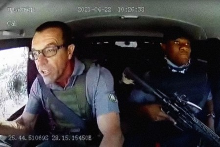 A driver who miraculously avoided an attempted armed robbery speaks