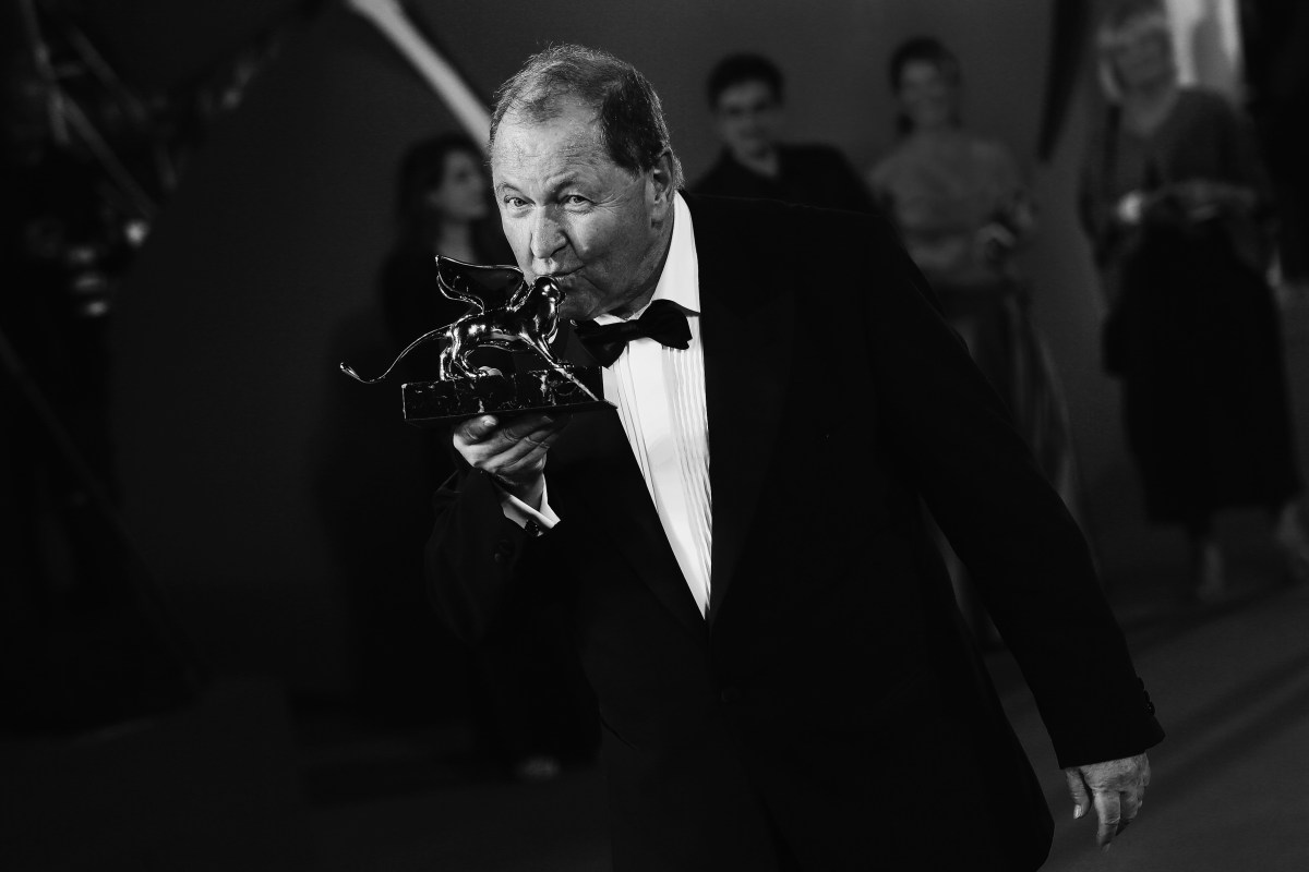 Director Roy Andersson poses with the Golden Lion Award for Best Film for 'A Pigeon Sat On A Branch Reflecting On Existence' during the award winners photocall of the 71st Venice Film Festival