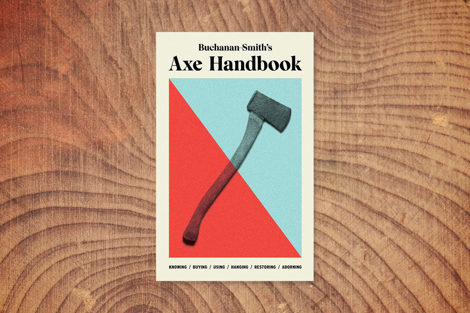 The cover of Peter Buchanan-Smith's book "Axe Handbook" on a wood grain background