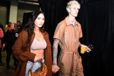 Machine Gun Kelly and Megan Fox hold hands