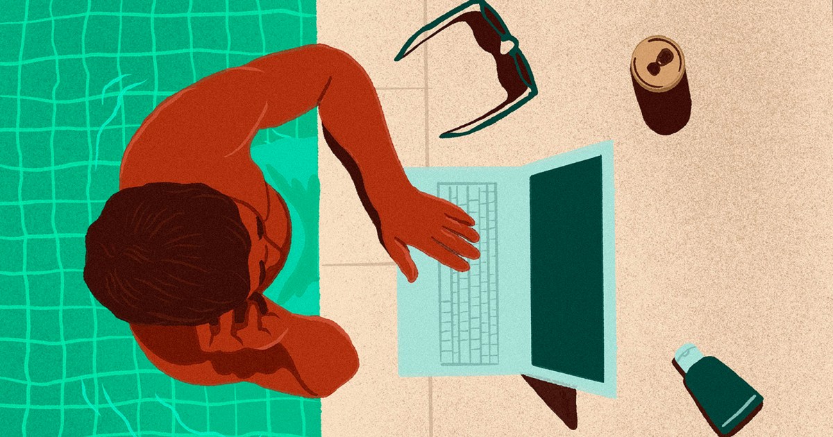 Man in a pool with his laptop