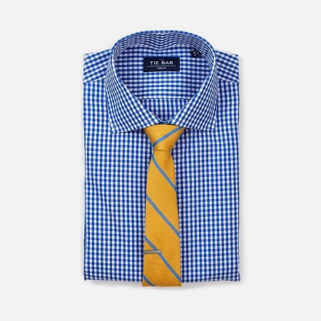A dress shirt and tie from The Tie Bar, all up to 70% off during Memorial Day weekend
