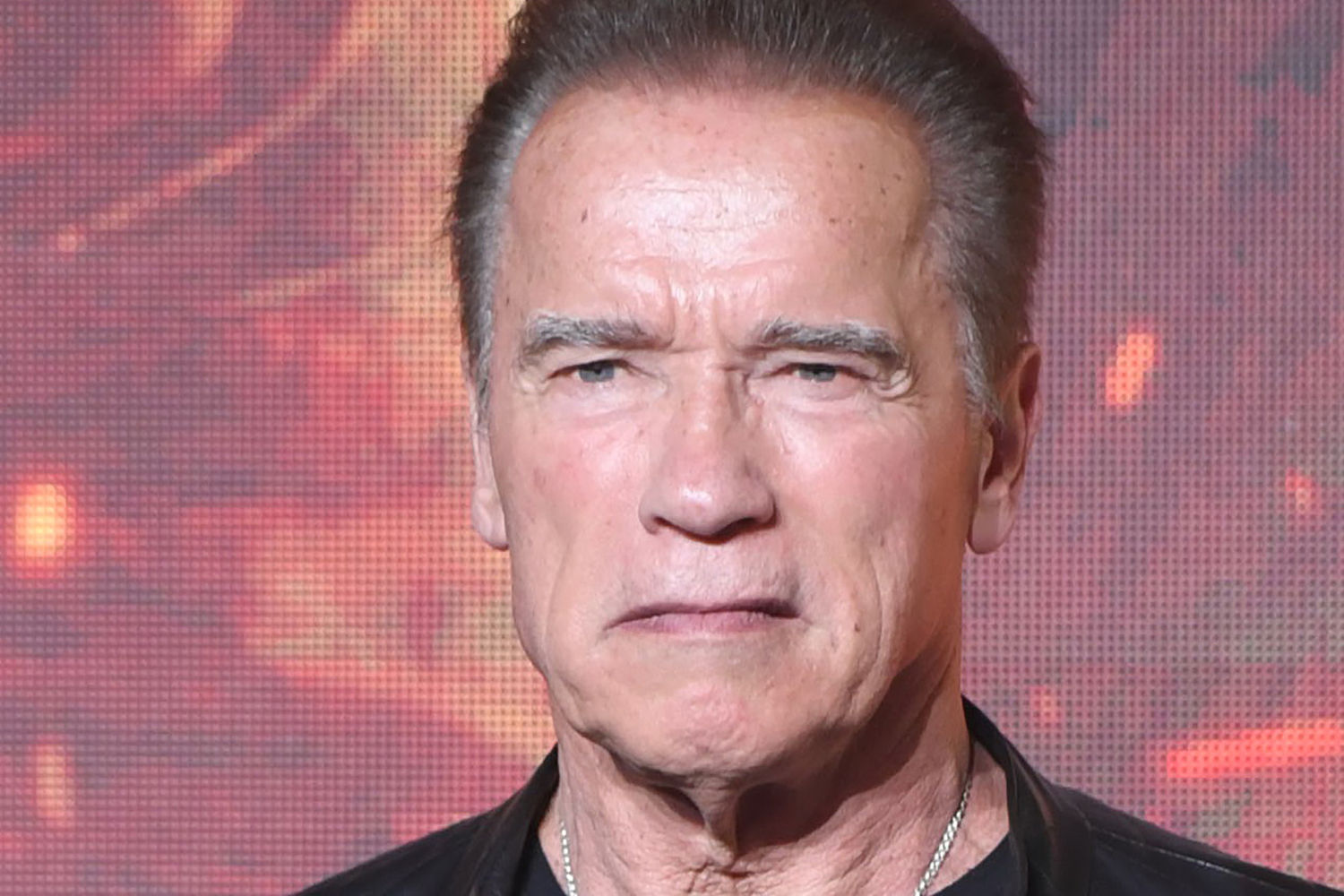 Closeup of Arnold Schwarzenegger's face looking disgruntled