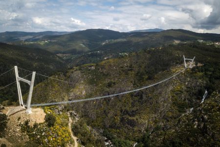An aerial view shows the 516 Arouca Bridge, the world's longest pedestrian suspension bridge with a length of 516 meters and a height of 175 meters, in Arouca in northern Portugal on April 29, 2021.