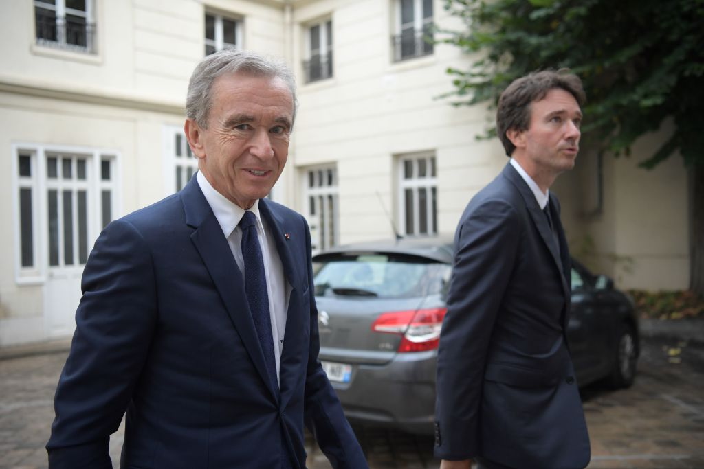 LVMH CEO Bernard Arnault and his son Antoine Arnault arrive at Paris' Archbishop residence on September 24, 2019.