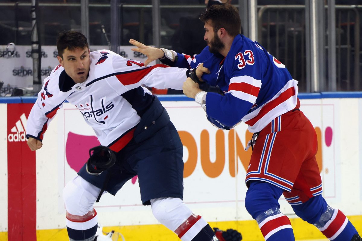 Garnet Hathaway of the Capitals fights with Phillip Di Giuseppe of the Rangers. 