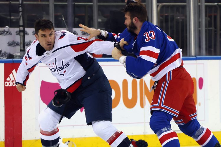Garnet Hathaway of the Capitals fights with Phillip Di Giuseppe of the Rangers. 