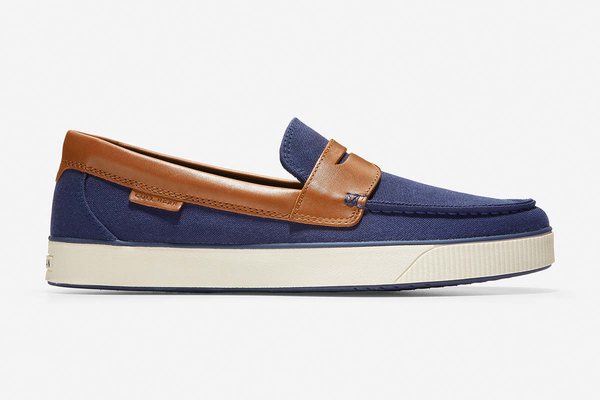 A blue and tan Nantucket Penny Loafer from Cole Haan