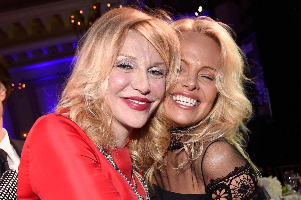 Courtney Love and Pamela Anderson embrace