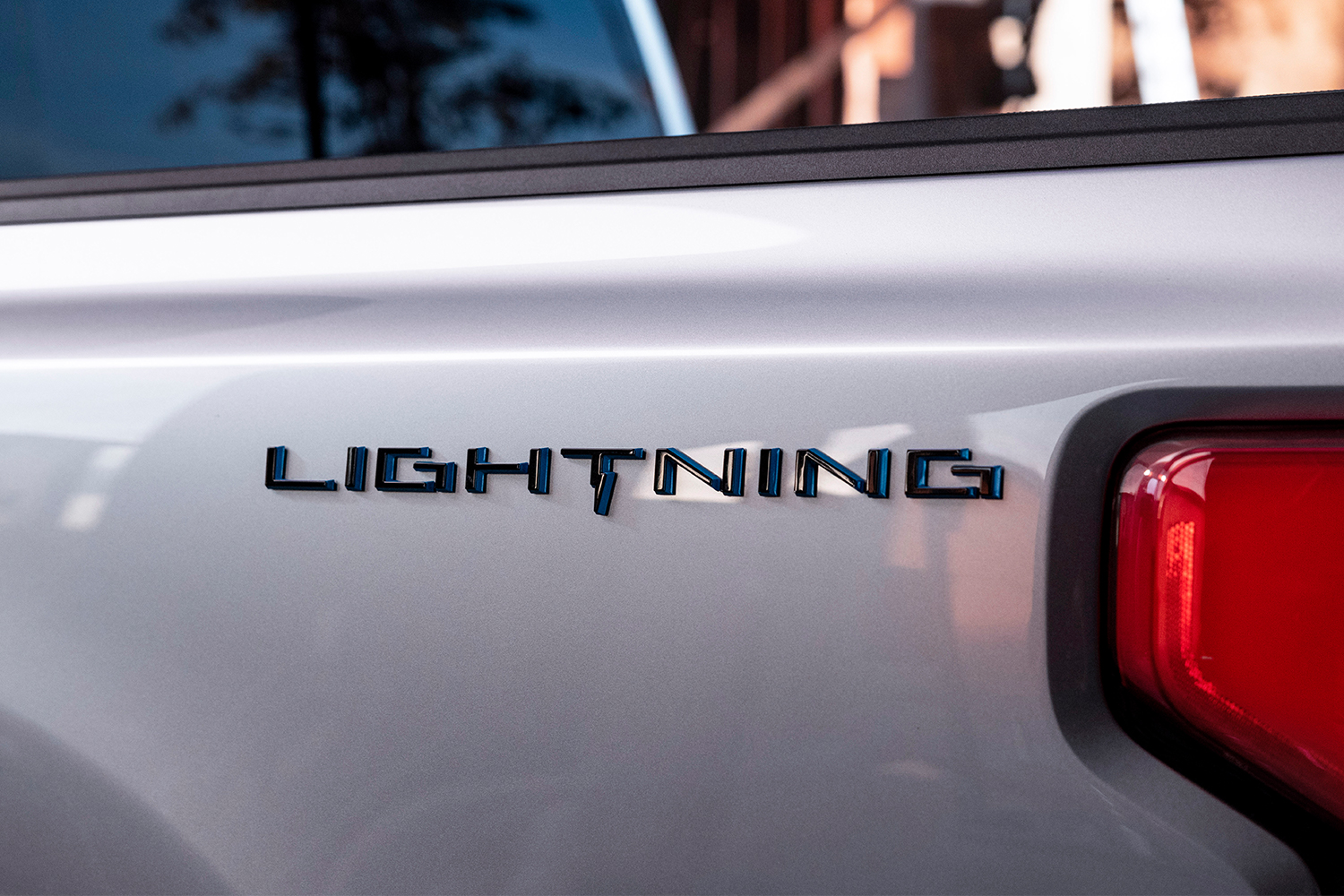The word Lightning on the side of Ford's new electric F-150 pickup truck