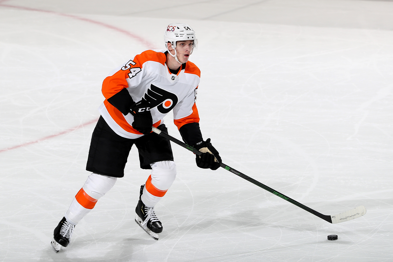 Egor Zamula #54 of the Philadelphia Flyers takes the puck in the third period against the New Jersey Devils at Prudential Center on April 27, 2021