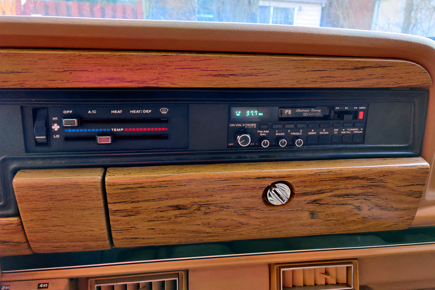 The period-correct tape deck of a 1987 Jeep Grand Wagoneer
