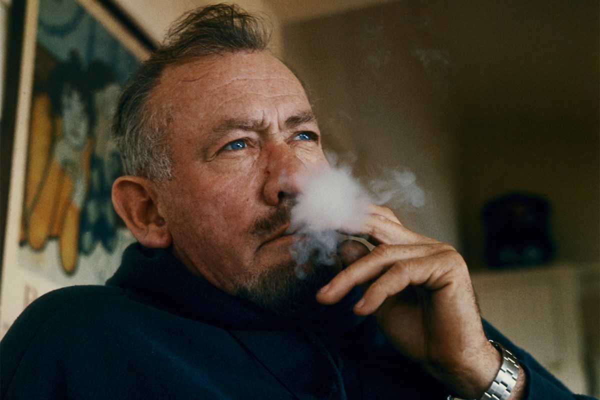 Author John Steinbeck smoking at his house in Sag Harbor, Long Island in 1962