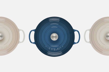 Le Creuset's round wide dutch oven shot from overhead in blue and white