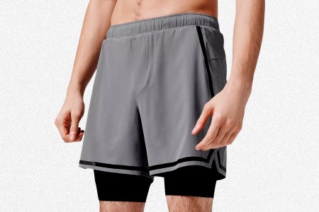 A man wearing Lululemon's Lined Surge Shorts
