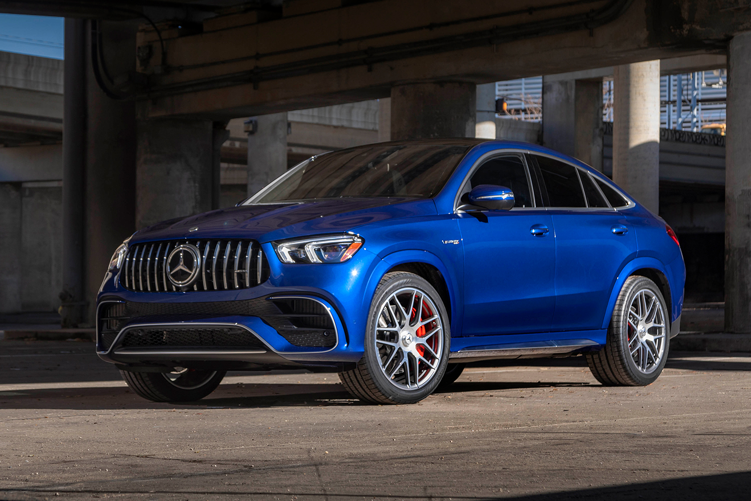 A blue Mercedes-AMG GLE 63 S Coupe sitting under an overpass