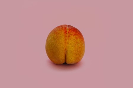Peach on dusty pink background.