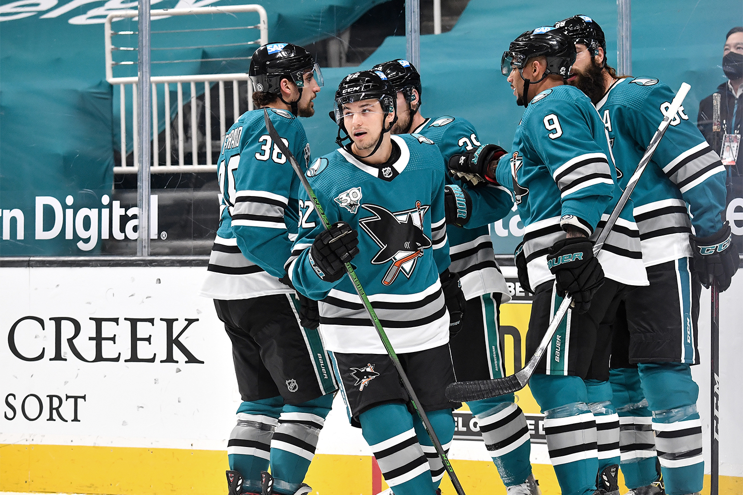 Kevin Labanc #62, Brent Burns #88, Logan Couture #39, Mario Ferraro #38 and Evander Kane #9 of the San Jose Sharks celebrate scoring a goal against the Los Angeles Kings at SAP Center on April 9, 2021