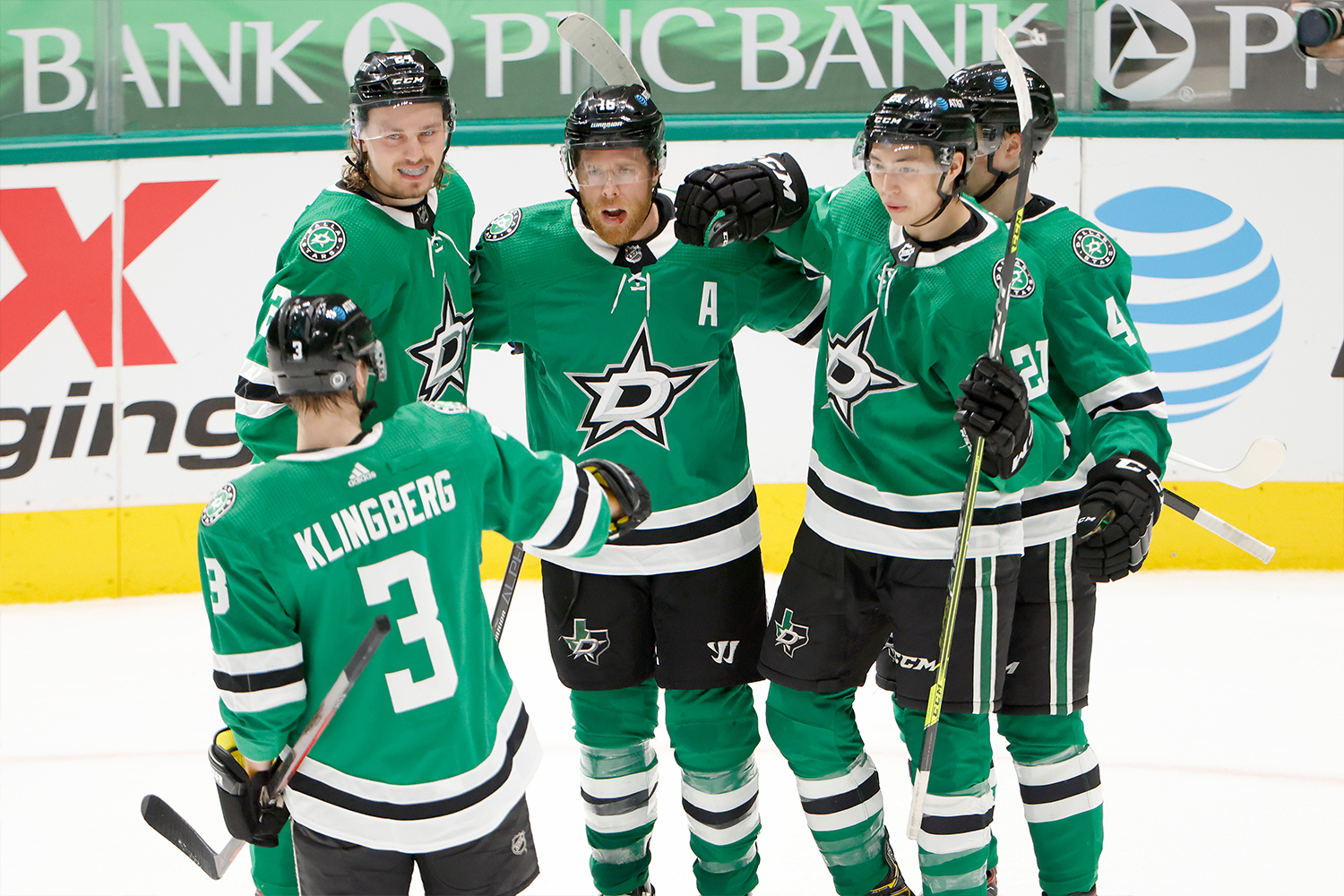Joe Pavelski #16 of the Dallas Stars celebrates with Roope Hintz #24 of the Dallas Stars, Jason Robertson #21 of the Dallas Stars, Miro Heiskanen #4 of the Dallas Stars and John Klingberg #3 of the Dallas Stars after scoring a goal against the Tampa Bay Lightning at American Airlines Center on March 25, 2021