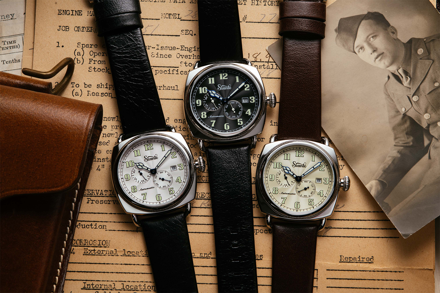 The three versions of Szanto's Officer's Coin Cushion 6200 Series watches lying flat on a table