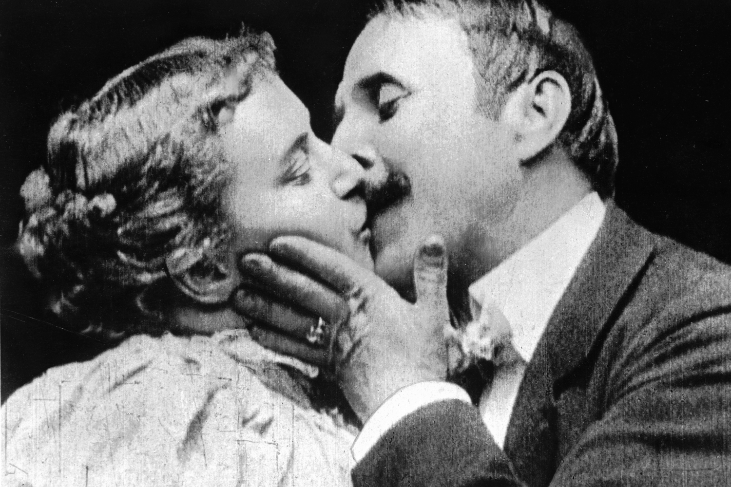 May Irwin and John C Rice stars of the Broadway play 'The Kiss', reenact the play's famous kissing scene for the Edison Company's cameras.