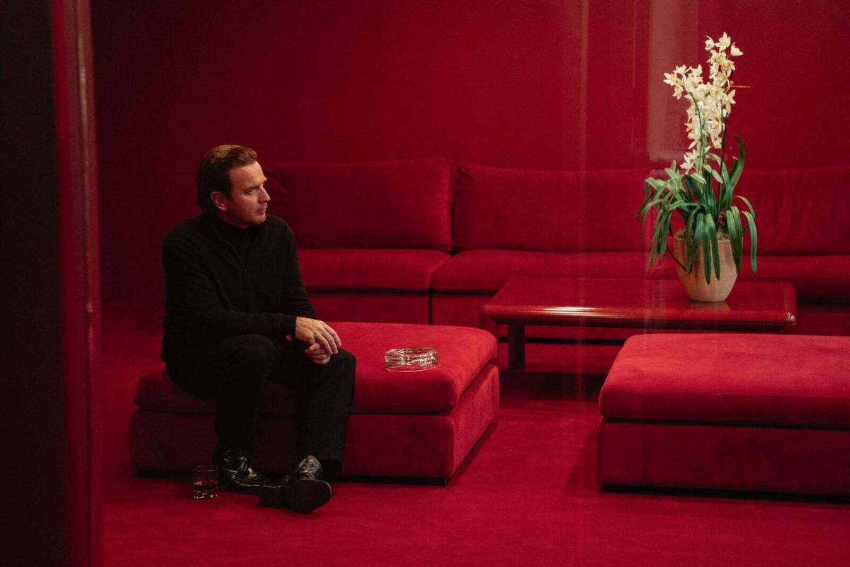 Halston (portrayed by Ewan MacGregor) admires one of his precious orchids in the new Netflix series on his life and career