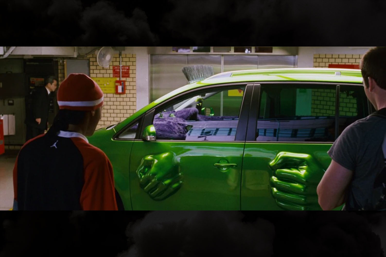 Hulk fists smashing through the doors of the mean green 2005 Volkswagen Touran owned by Twinkie (Bow Wow) in The Fast and the Furious: Tokyo Drift