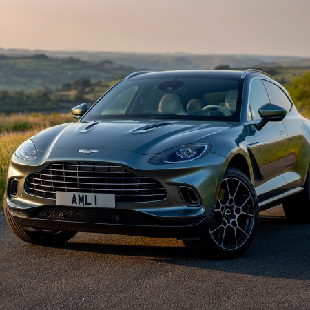 The 2021 Aston Martin DBX SUV in green in the countryside