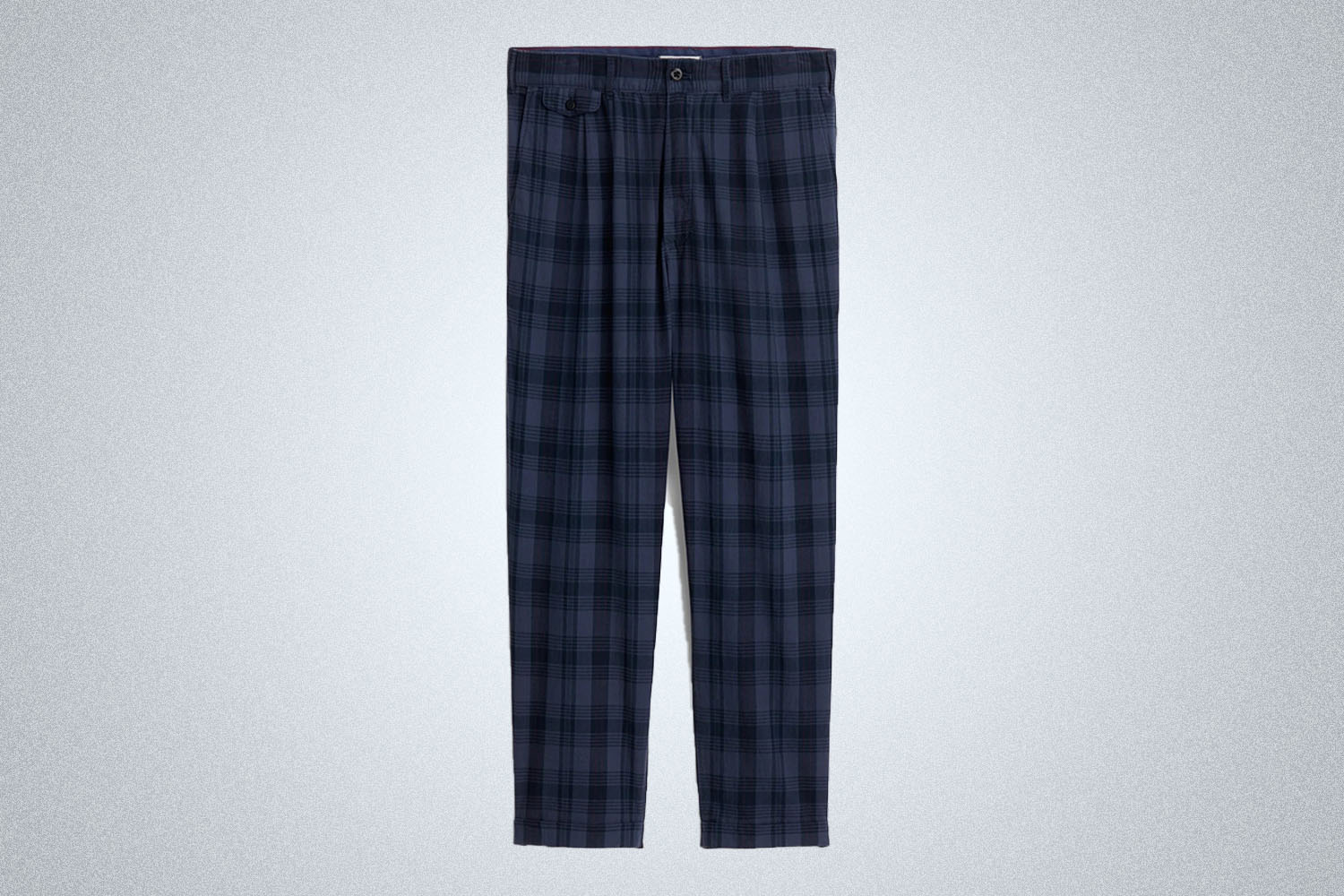 a pair of Alex mill madras pleated pants on a grey background