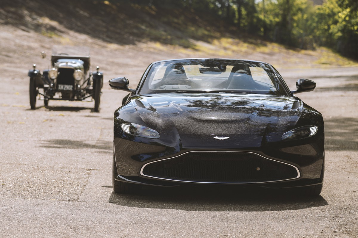 A new Aston Martin Vantage Roadster flanked by the A3, the British marque's oldest surviving car. The Vantage is an anniversary tribute to the 1921 car.