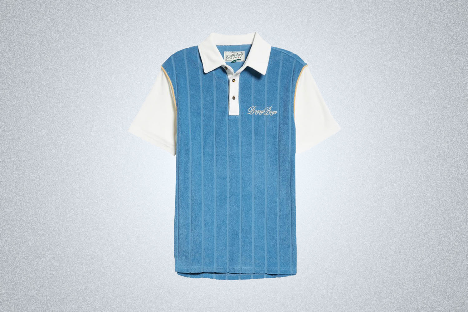 a blue terry polo from Bogey Boys on a grey background