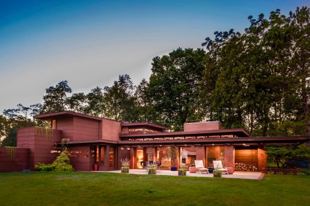 Frank Lloyd Wright’s Life Magazines Dream House is one of the best Airbnbs on Lake Michigan in 2021. This rental is pictured at dusk on Lake Michigan