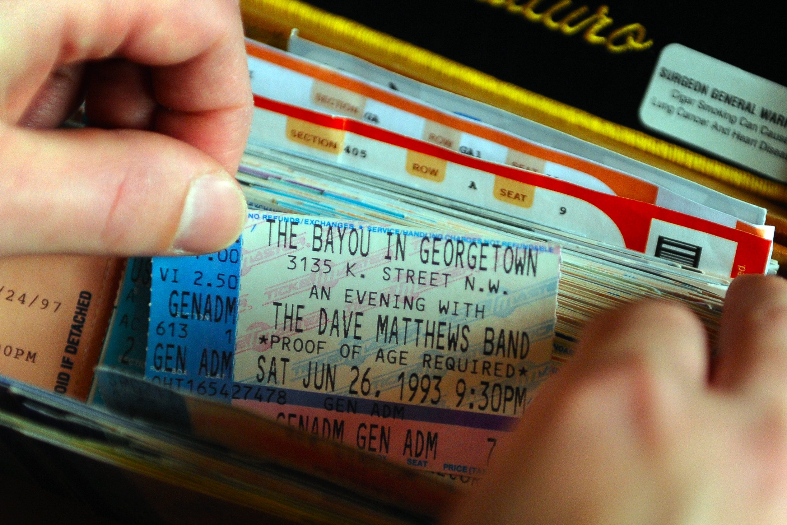 A collection of old concert tickets, including a Dave Matthews Band ticket from 1993