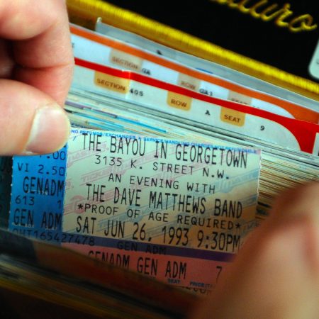 A collection of old concert tickets, including a Dave Matthews Band ticket from 1993
