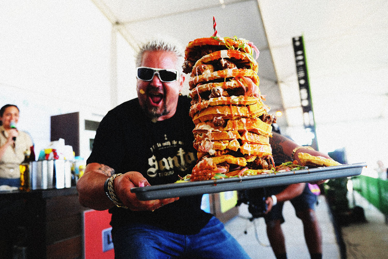 Guy Fieri doing his take on chicken and waffles at the South Beach Wine and Food Festival