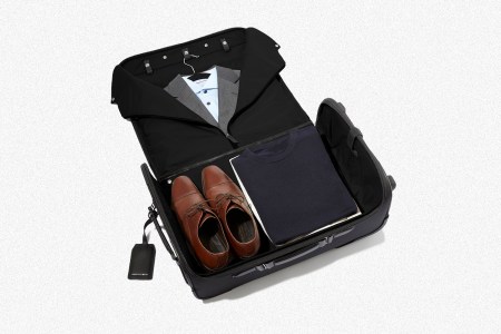 A Garment Luggage Carry-On from Hook & Albert opened to show a suit