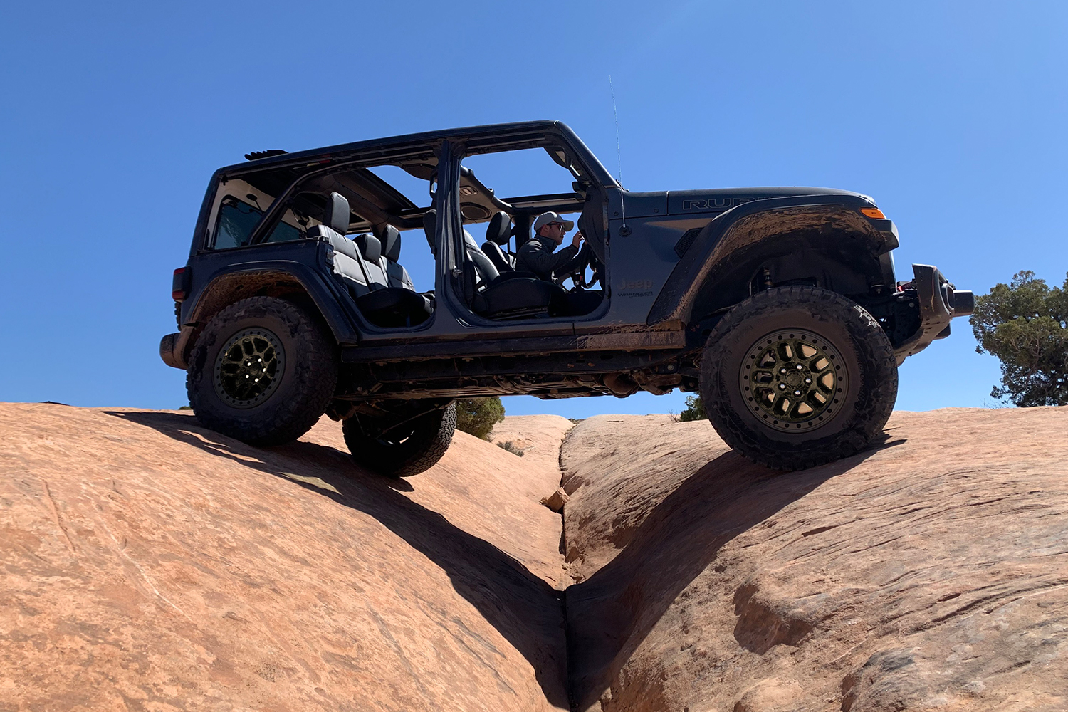 A black Jeep Wrangler with no doors and the new Xtreme Recon Package. The off-road edition is meant to compete with the Ford Bronco.